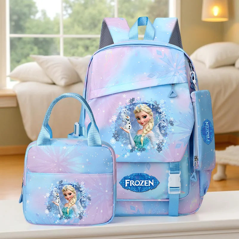 Frozen-themed backpack and lunch bag set on a surface with a blurred indoor background